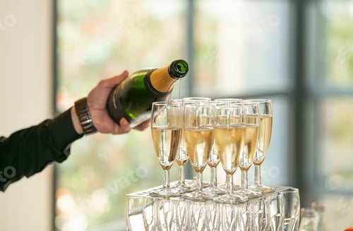 Preview: The waiters pouring champagne at a wedding