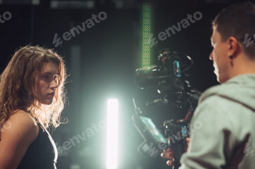 Preview: Athletic Beautiful Woman posing for camera man at gym.