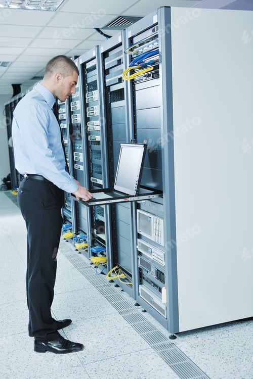 Preview: Young Handsome Business Man Engeneer In Datacenter Server Room