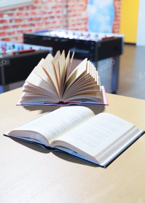 Preview: open book on the table. close-up of a fanned book