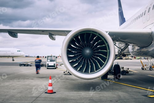 Preview: Busy day at airport. Ground crew preparing airplane before flight.Travel and industry concepts.