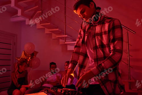 Preview: Man mixing music on Christmas party