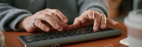 Preview: Header Image of Caucasian Middle Aged Man Typing on Keyboard in Indoor Workspace