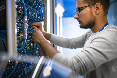 Preview: Engineer Working with Servers