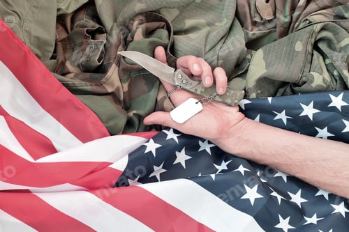 Preview: Dog tags lies with hand of man who commit suicide with a knife