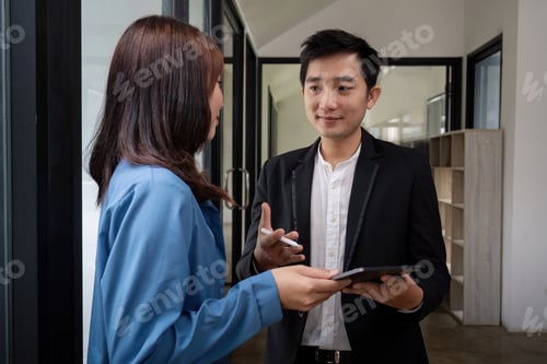 Preview: Business Team Discuss Analysis in Modern Office Setting with Digital Tablet and Professional Attire