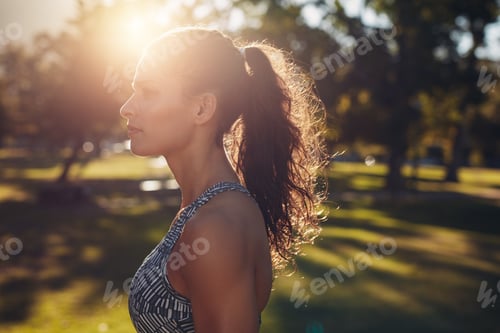Preview: Fit young woman standing at the park