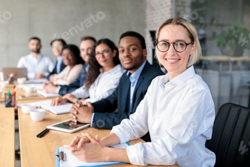 Preview: Multiethnic Business People Sitting Having Corporate Meeting In Office
