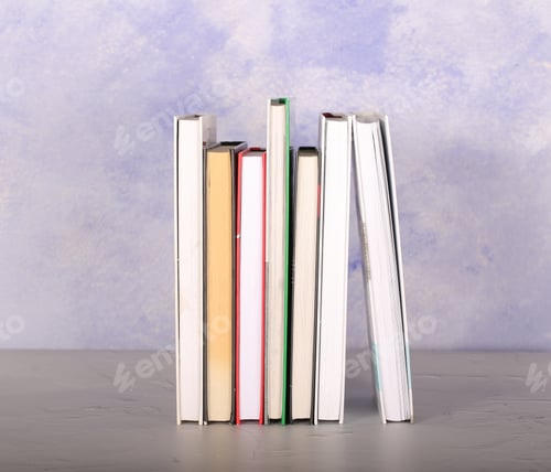 Preview: Books And A Cup Lie On A Light Background