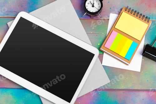 Preview: Modern blank digital tablet with papers and pen on a wooden desk. Top view