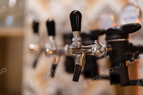 Preview: Close up beer taps background in the restaurant