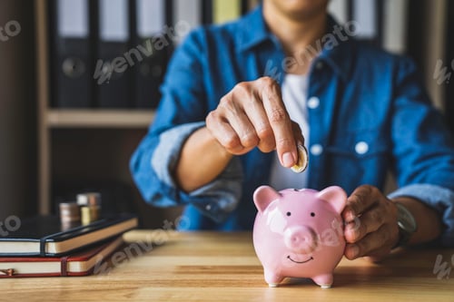 Preview: woman holds a coin in a pig-shaped piggy bank to save money for the future. after retirement and rec