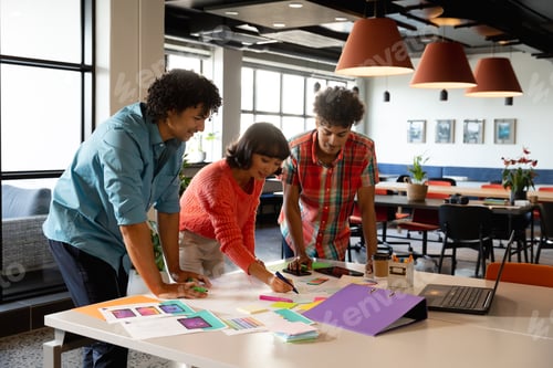 Preview: Multiracial design professionals planning strategy in meeting at office