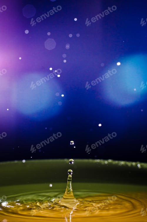 Preview: The water drop with interesting colorful blurred background