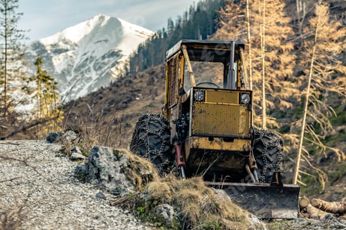 Preview: Bulldozer resting in high mountains after work
