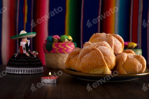 Preview: Dead bread and mexican handicrafts with colorful sarape in the background.