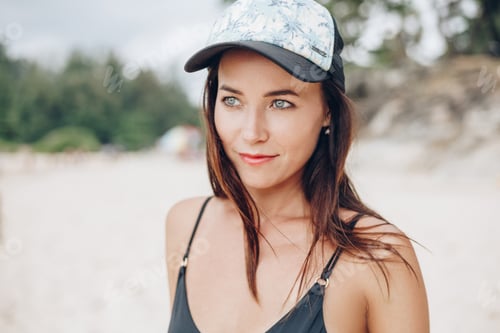 Preview: portrait of attractive young woman in cap