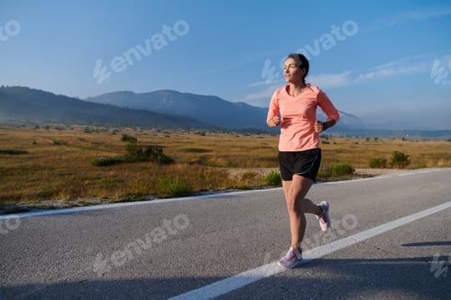 Preview: Determined Dawn: Confident and Motivated Athlete Embarks on Sunrise Run.