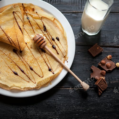 Preview: Stack of tasty pancakes with butter and honey for breakfast