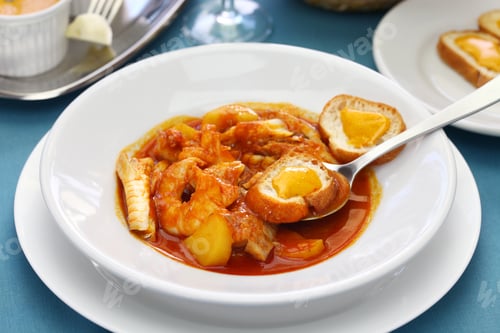 Preview: Hearty Seafood Stew with Bread in White Bowl