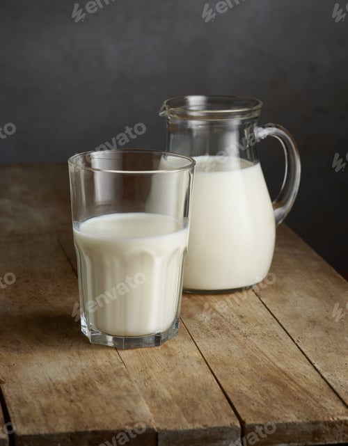 Preview: milk jug and glass on wooden table