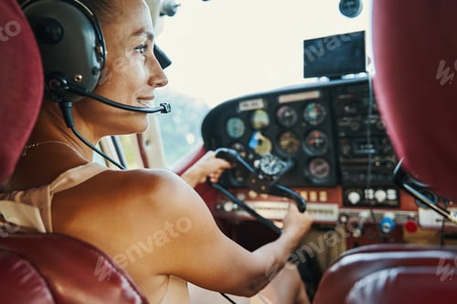 Preview: Close up of young brunette sitting in the cockpit
