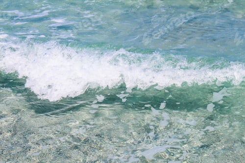 Preview: Closeup shot of the turquoise water of the sea captured in San Teodoro, Sardinia