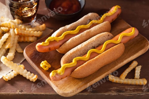 Preview: grilled hot dogs with mustard and french fries
