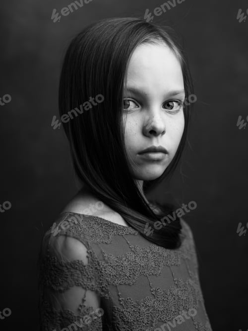 Preview: portrait of a little girl on a dark background dress model cropped view black and white photography