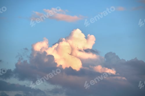 Preview: Bright landscape of white puffy cumulus clouds on blue clear sky.