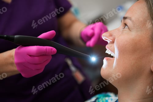 Preview: Young female patient sitting on chair in dental office.preparing for dental exam