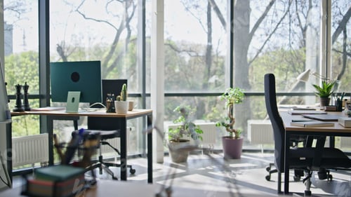Preview: Creative office workspace room. Selective focus on steel sculpture. No people
