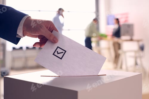 Preview: Person Casting Ballot Into Box