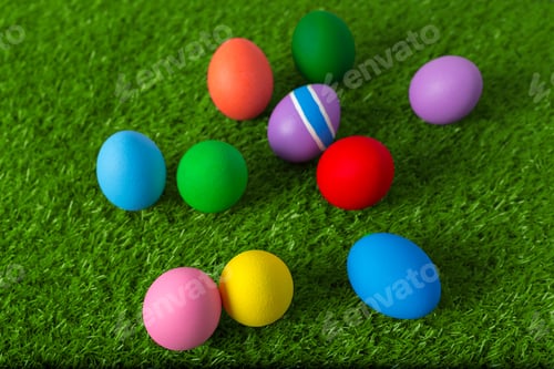 Preview: Colorful Easter eggs scattered on green grass during spring celebration