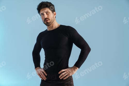 Preview: Handsome athletic sportsman posing and looking at camera