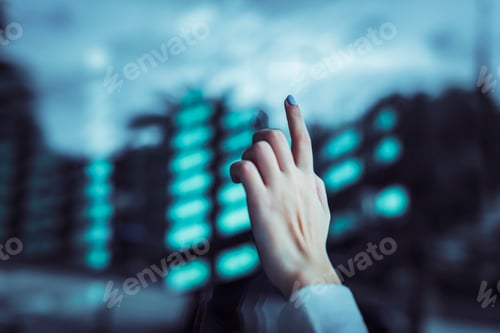 Preview: Hand touching a transparent digital screen