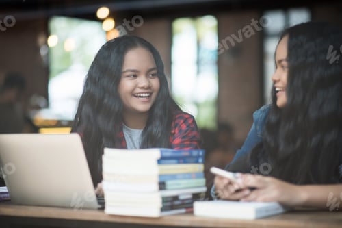 Preview: Group of happy friends student talking about knowledge in cafe