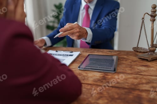 Preview: Lawyer advising client on contract agreement