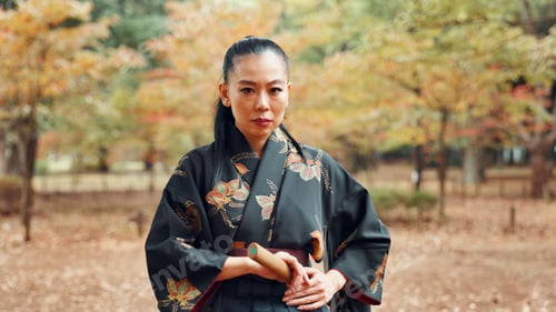 Preview: Portrait, serious and woman with kimono, martial arts and weapon for training, fighter and aikido.