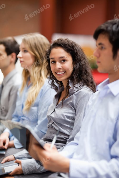 Preview: Portrait Of A Businesswoman Smiling At The Camera During A Presentation