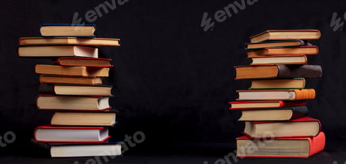 Preview: Vintage books stack on black background