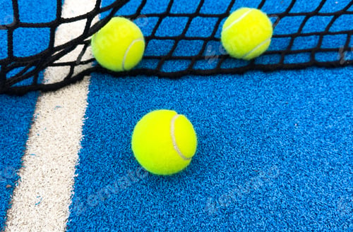 Preview: r sport concept with padel tennis ball on white line on padel tennis court blue color. Flat lay