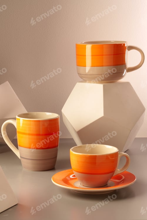 Preview: Colorful clay ceramic cups on gray background