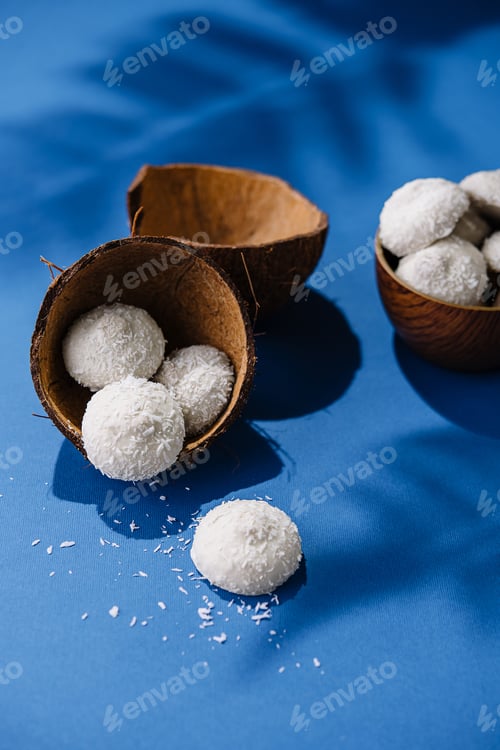 Preview: Coconuts with candies on blue table