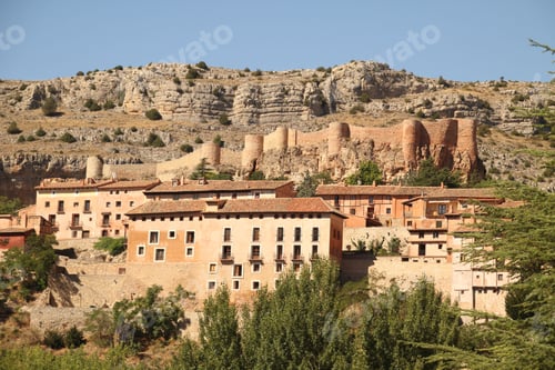 Preview: Scenic view of Albarracin, Spain, showcasing historic buildings and a rocky hillside