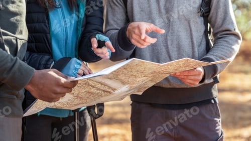 Preview: Cropped of travelers holding map, looking for their location