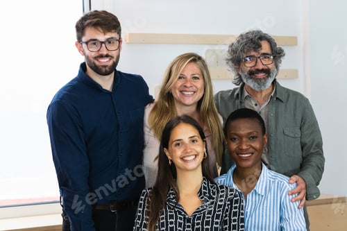 Preview: Cheerful diverse coworking women looking at camera
