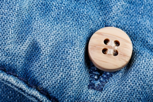 Preview: Denim Jeans Texture Background With Torn. The Texture Of The Colored Cotton Fabric. Stitched