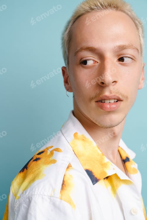 Preview: Young blonde man in shirt posing and looking aside