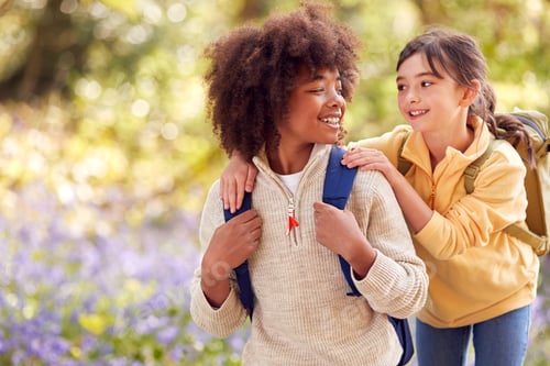 Preview: Two Children Walking Through Bluebell Woods In Springtime Together